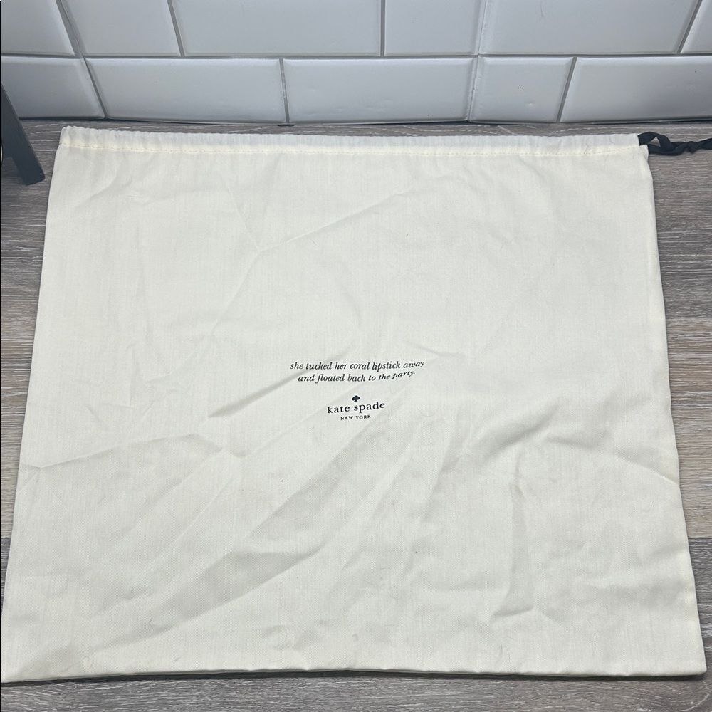 A12 | Kate Spade Ivory Drawstring dust jacket bag